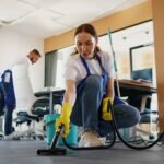 professional-cleaning-service-person-using-vacuumcleaner-scaled